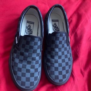 Vans black and gray check slip ons